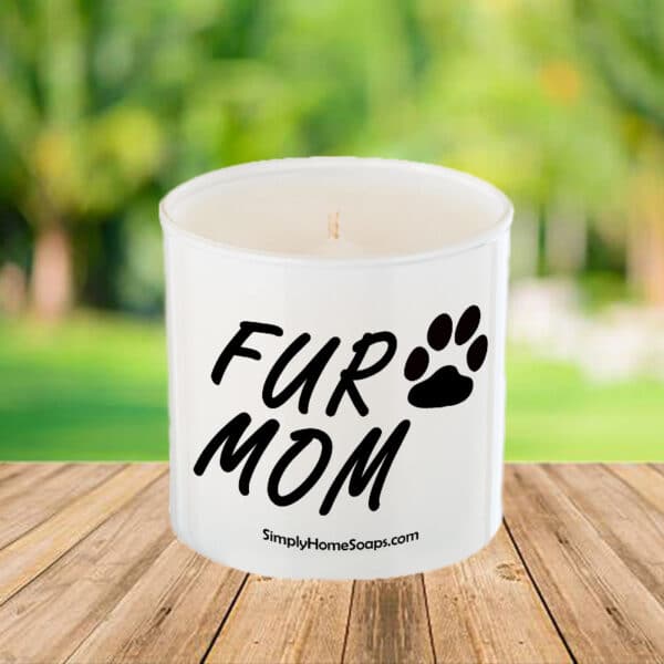 Fur Mom candle in elegant glass container.