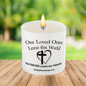 Close Up of ‘Our Loved Ones Leave This World But Never Leave Our Hearts’ Candle Saying