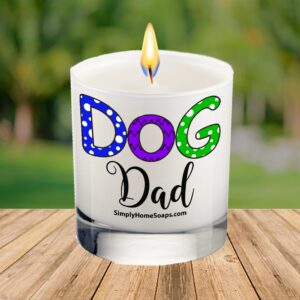 Dog Dad candle in an elegant glass container